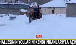 Mahallesinin yollarını kendi imkanlarıyla açıyor